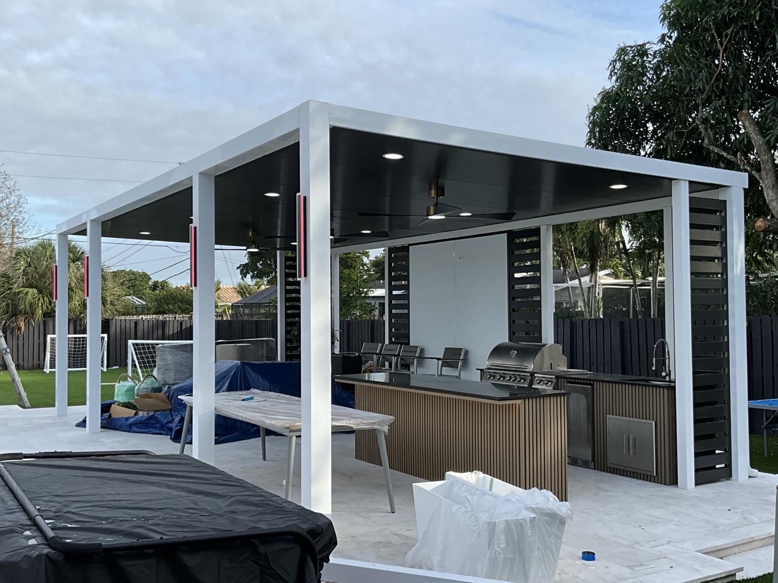 Side view of the finished pergola and outdoor kitchen