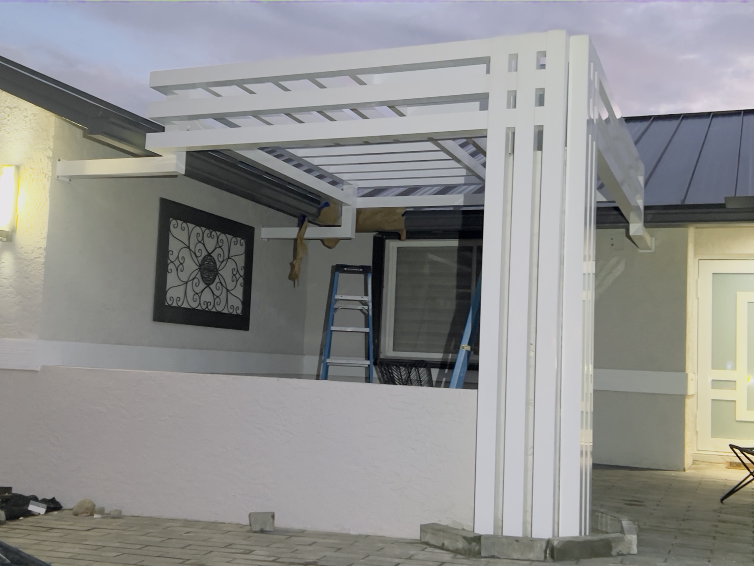 Evening view of the installed white pergola